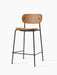 Angled view of the Co Counter Chair, fully upholstered in tan Dakar leather with a slender black steel frame.