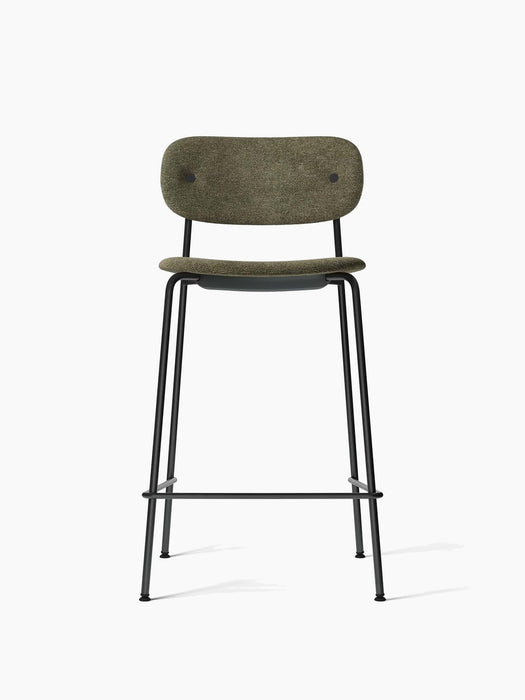 Front view of the Co Counter Chair, Fully Upholstered, with a moss green fabric seat and backrest on a black steel frame.