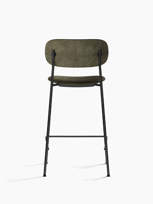Back view of the Co Counter Chair, Fully Upholstered, with a black steel frame and moss green upholstery.