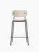 Front view of the Co Counter Chair, Fully Upholstered. The chair has a slim black metal frame and light beige upholstery.