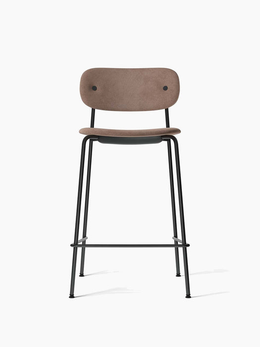 Front view of the Co Counter Chair, Fully Upholstered, with a light brown fabric seat and back on a slim black steel frame.