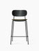 Front view of the Co Counter Chair with a black oak backrest, moss green upholstered seat, and slender black steel frame.