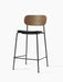 Co Counter Chair, Seat Upholstered, with a dark oak back, black leather seat, and black steel frame, viewed at an angle.