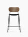 Co Counter Chair from the front, with a dark stained oak backrest, black leather seat, and thin black steel frame.