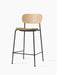 Co Counter Chair with a natural oak backrest, a seat upholstered in Audo Bouclé 06, and a black steel frame.