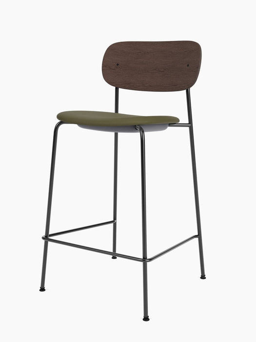 A Co Counter Chair, Seat Upholstered, with a dark stained oak backrest, an olive green seat, and a thin black metal frame.