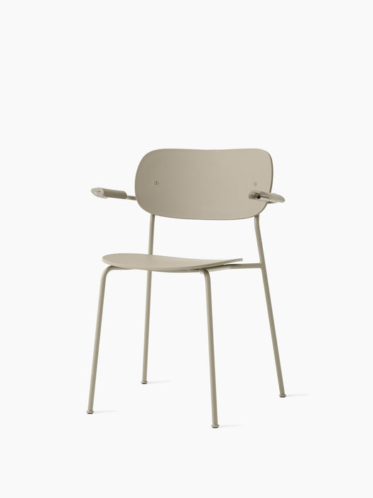 A light-coloured Co Dining Chair, Outdoor with armrests and slender frame, shown at an angle against a white background.