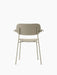 A back view of the Co Dining Chair, Outdoor with armrests, in a muted, solid colour against a white background.