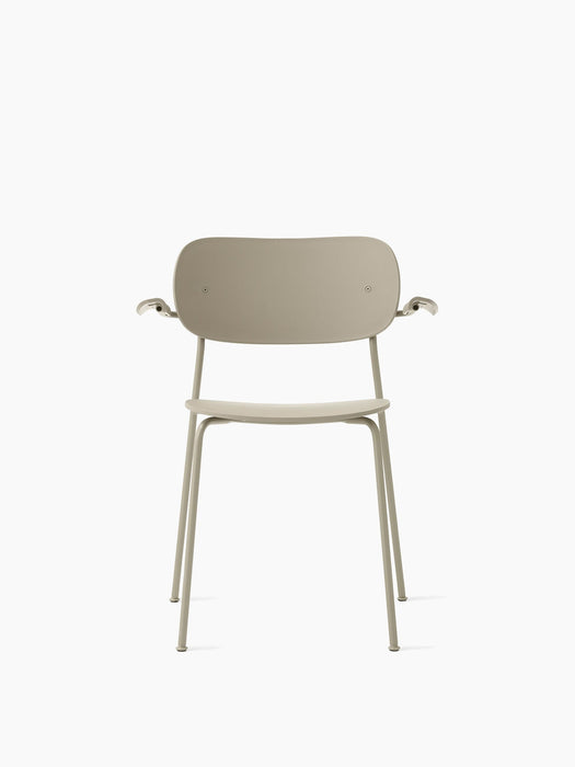 Front view of the Co Dining Chair, Outdoor with armrests in an ivory finish featuring a slim frame, seat and curved backrest.