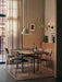 Co Dining Chairs around a Snaregade table on a Houkime Rug, illuminated by a Levitate Pendant light in a cosy dining room.