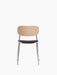 A front view of the Co Dining Chair, featuring a natural oak backrest, a dark upholstered seat, and a slender chrome frame.