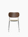 A front view of the Co Dining Chair with a dark stained oak backrest, a light bouclé upholstered seat, and a chrome frame.