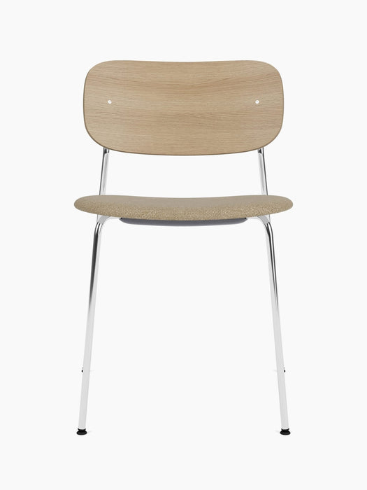Front view of the Co Dining Chair with an upholstered seat, chrome frame, natural oak backrest and beige fabric seat.