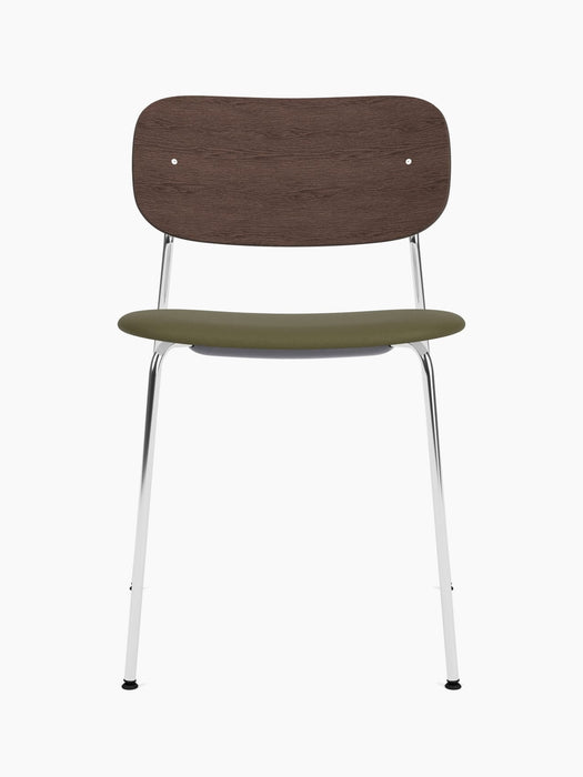 Front view of the Co Dining Chair with a dark stained oak backrest, an olive green upholstered seat, and chrome frame.