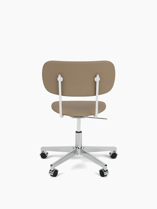 Rear view of the beige upholstered Co Task Chair, with a polished aluminium frame and five-star base with black casters.
