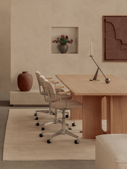 A calm office setting featuring two Co Task Chairs at an Androgyne Dining Table with an Interconnect Candle Holder on top.
