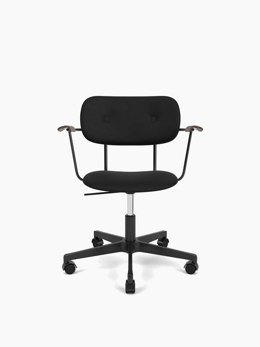 Front view of the fully upholstered black Co Task Chair with dark wood armrests and a five-star base with wheels.