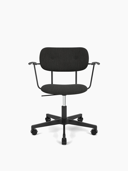 The Co Task Chair, fully upholstered with armrests and a black base with casters, shown against a plain white background.