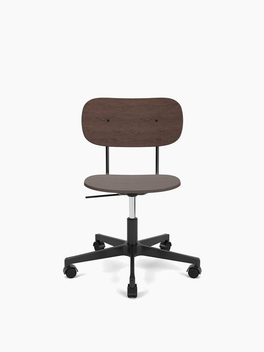 Front view of the Co Task Chair, Veneer, featuring a dark stained oak seat and back on a black five-star base with wheels.