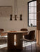 A Collector Chandelier, 3 hangs above a wooden Androgyne Dining Table and Penguin Chairs in a naturally lit dining room.