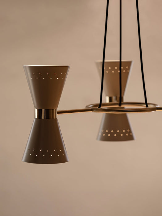 A detailed close-up of the Collector Chandelier, 3, showing a cream hourglass-shaped shade with a polished brass band.