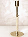 A detailed close-up of the Duca Candlestick highlighting the polished brass finish and the intricately wrapped rattan handle.