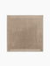 Top-down view of the square Duomo Rug in Limestone Beige. It has a decorative border with vertical stripes and fringed edges.