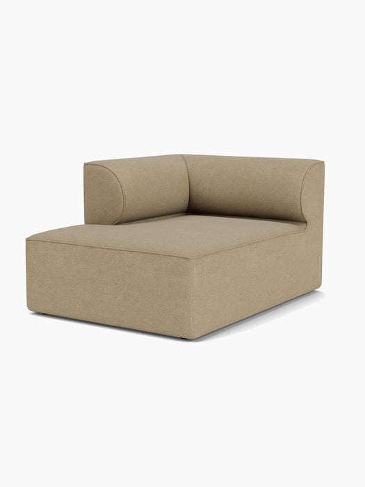 Angled view of the Eave Modular Sofa Chaise Longue module, featuring a low, curved backrest and light brown bouclé fabric.