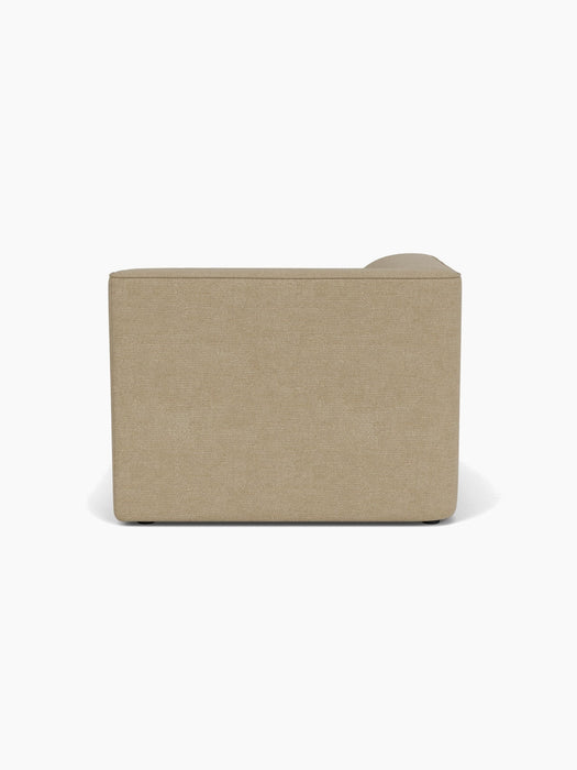 Back view of the Eave Modular Sofa, 96, Chaise Longue in light brown bouclé, shown against a crisp white background.