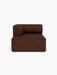 Front-on view of the Eave Modular Sofa, 96, Chaise Longue upholstered in a dark brown, textured Audo Bouclé 08 fabric.