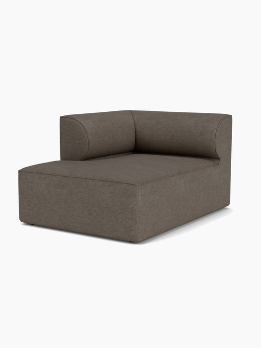 An angled view of the Eave Modular Sofa, 96, Chaise Longue module, with dark textured fabric and a low, curved backrest.