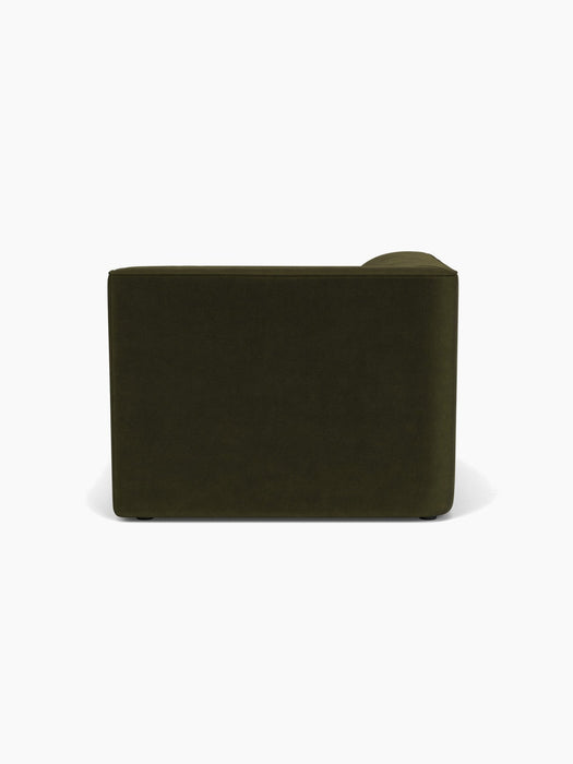 Back view of the Eave Modular Sofa, 96, Chaise Longue, upholstered in a dark green fabric, on a white background.