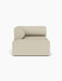 A front view of the Eave Modular Sofa, 96, Chaise Longue. The left-corner module is upholstered in a light beige fabric.