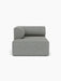 Front view of the Eave Modular Sofa, 96, Chaise Longue, a left-corner module with a curved armrest in grey-blue fabric.