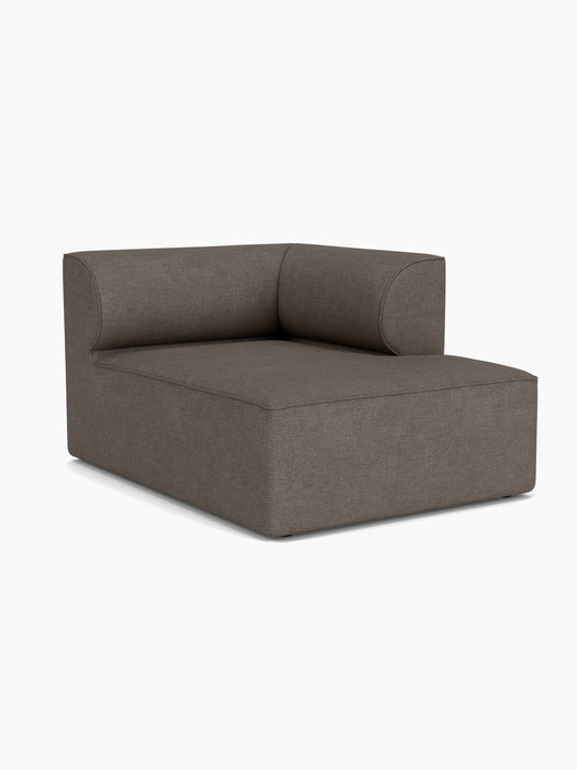 A right-hand Eave Modular Sofa, 96, Chaise Longue upholstered in dark brown Bouclé, viewed from an angle on white background.