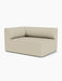 Angle view of the Eave Modular Sofa, 96, Corner 144 module. The sofa is upholstered in a light beige Savanna 202 fabric.