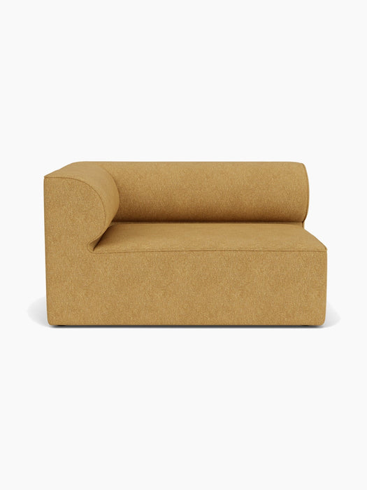 Front-on view of the Eave Modular Sofa, a left-hand corner piece, upholstered in a textured, mustard-yellow Moss 22 fabric.