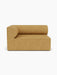 Front-on view of the Eave Modular Sofa, a left-hand corner piece, upholstered in a textured, mustard-yellow Moss 22 fabric.