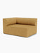 An angled view of the Eave Modular Sofa, 96, Corner 144. The module is upholstered in a textured, moss-yellow fabric.