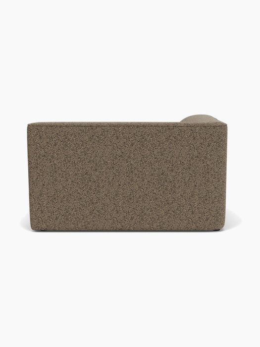 A back view of the Eave Modular Sofa, 96, Corner 144 in textured brown Safire 001 fabric against a plain white background.