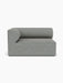Front view of the Eave Modular Sofa, 96, Corner 144. The left corner piece is upholstered in textured grey Safire 12 fabric.