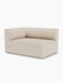 An angled view of the Eave Modular Sofa, 96, Corner 144 left-hand module, upholstered in a light beige textured fabric.