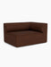 An angled view of the Eave Modular Sofa, 96, Corner 144, a corner module upholstered in a textured brown bouclé fabric.