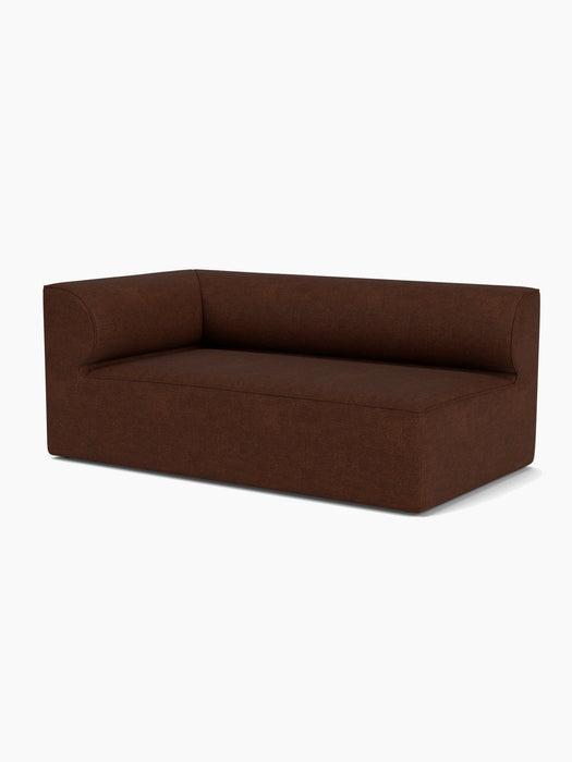 Angled view of the Eave Modular Sofa, 96, Corner 192. The left-corner piece is upholstered in a dark brown bouclé fabric.