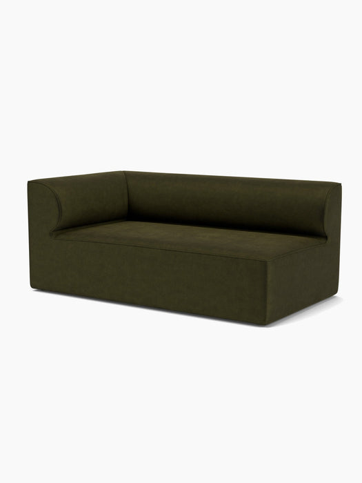 The Eave Modular Sofa, 96, Corner 192, shown from an angle. The L-shaped sofa is upholstered in a dark olive-green fabric.