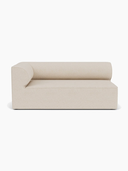 A front-on studio shot of the Eave Modular Sofa, 96, Corner 192. This left-hand module features a curved back and armrest.