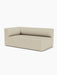 Angled view of the Eave Modular Sofa, 96, Corner 192, a left corner piece upholstered in a light beige textured fabric.