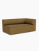 Angled view of the Eave Modular Sofa, 96, Corner 192 in a brown bouclé fabric. The minimalist piece has a low, curved back.