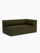 A studio shot of the Eave Modular Sofa, 96, Corner 192, a right-hand corner module in dark olive green fabric.