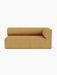 Front view of Eave Modular Sofa, 96, Corner 192 in a mustard yellow textured fabric, with a rounded back and right armrest